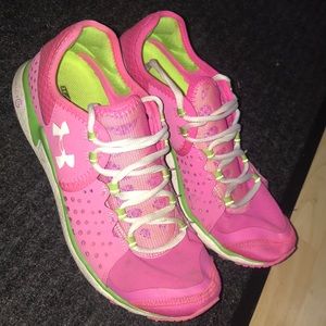 Pink, white, and green running shoes. Little wear